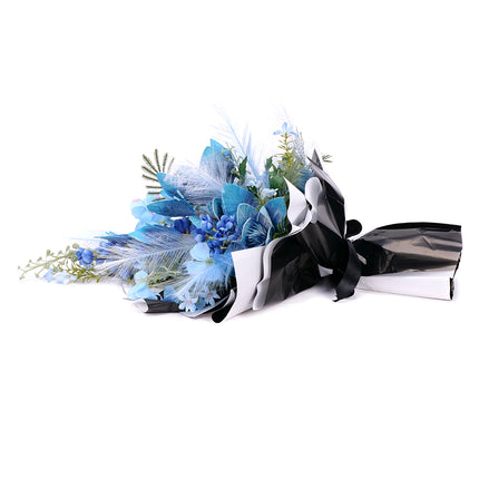 03001888_irigo-trauerstrauss-mit-blauer-magnolie-hortensie-und-rittersporn